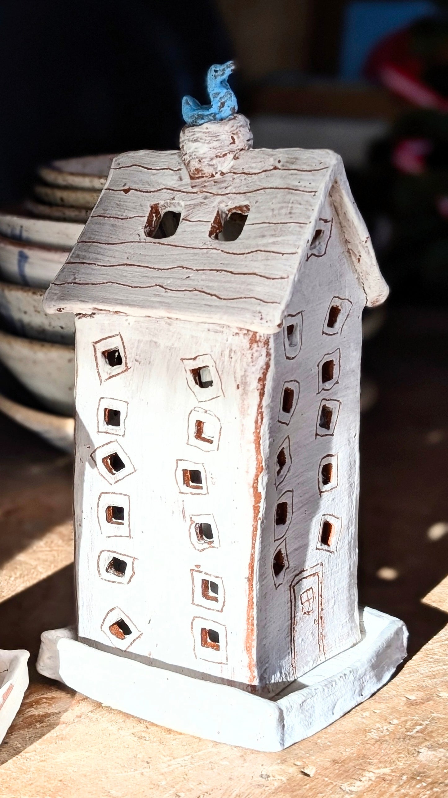 Whimsical Ceramic Lumiere with Watchful Blue Bird